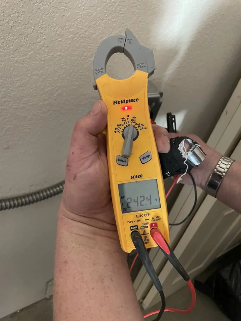 Voltage testing with clamp meter during Outlet Installation in China